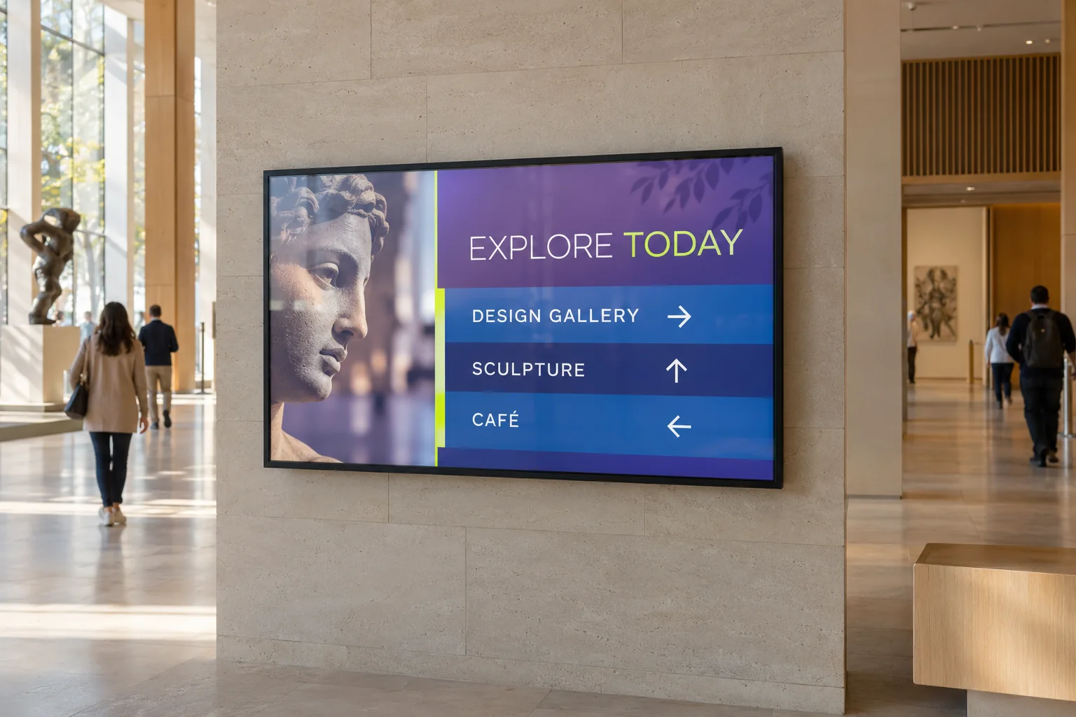 A gallery, sculpture and café direction screen in a museum entrance.