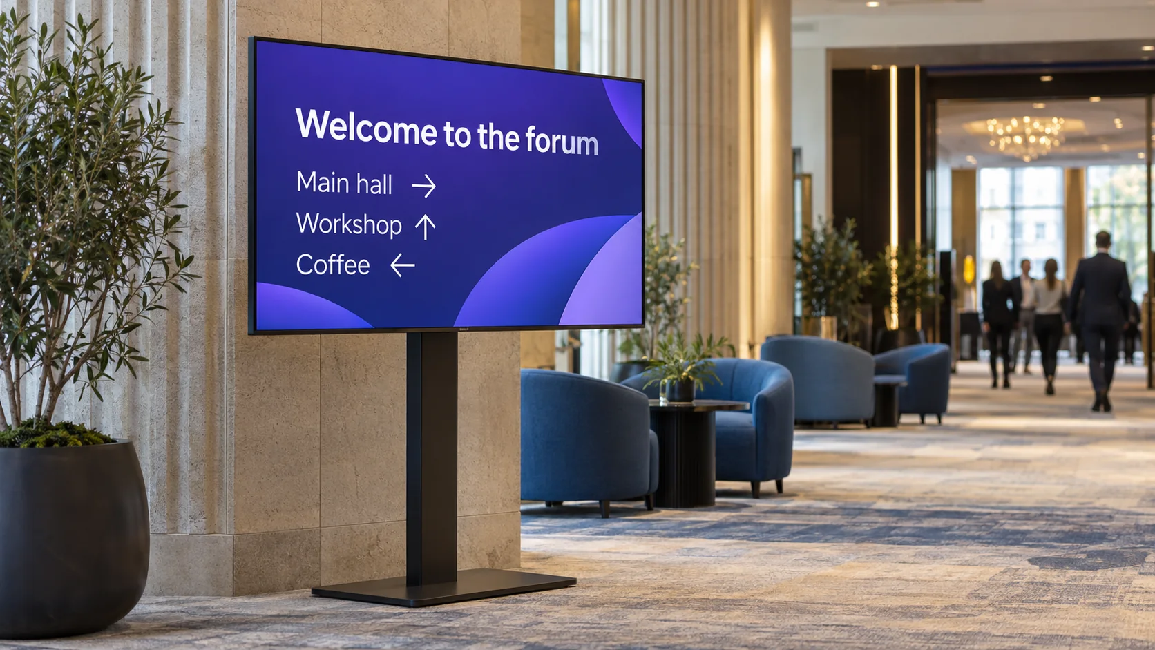 A conference-foyer TV showing directions to the main hall, workshop and coffee.