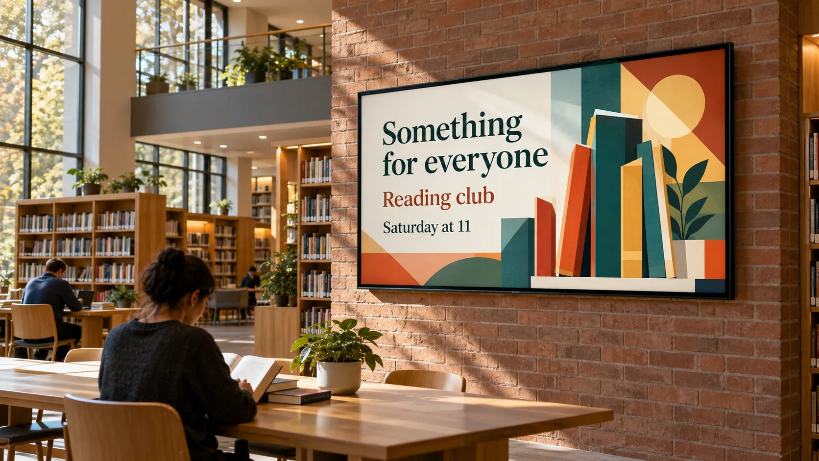 A library TV advertising a reading club beside shelves and reading tables.